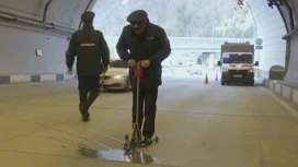 Traffic police officers checked the quality of the road surface in the tunnel Dubler Resort Avenue in Sochi