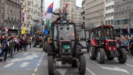 Column of hundreds of tractors with protesting farmers drives to downtown Belgrade