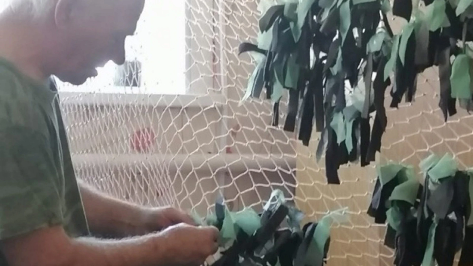 Near Astrakhan, villagers make camouflage nets for SVO participants